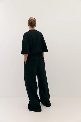 flared abel trouser, harris tapper, black trousers, black pants, flared back pants, low waisted pants, low waisted black pants, suit material black flared pants